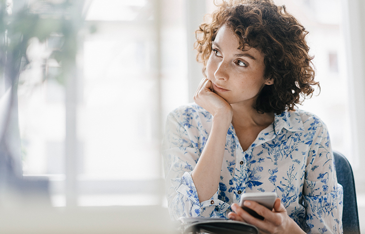 Woman staring off lost in through